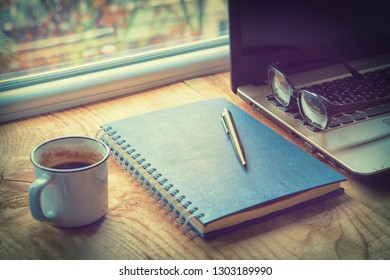 Office desk window coffee laptop notebook - Shutterstock ID 1303189990