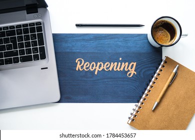 Office Desk With The Word Reopening