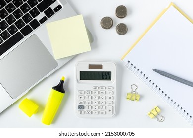 Office Desk, Workplace Top View. Workplace With Blank Board, Laptop, Calculator, Money, Stationery On White Background.