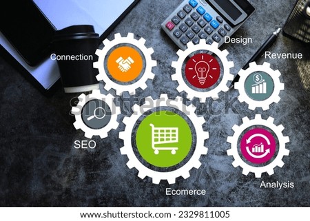 office desktop black mood with info graphic gear up on online trading processes such as e-commerce, SEO, connections, data analytics design and revenue. Digital marketing concept.