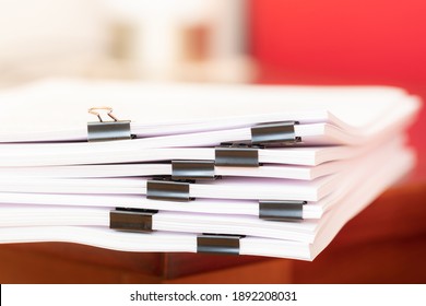 Office documents bound together by a paper clips