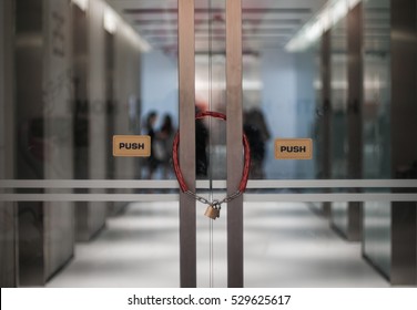 The Office Door Locked With Metal Chain And Padlock 