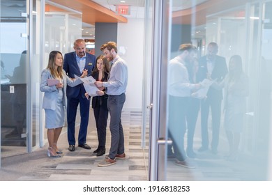 Office Employee Having A Meeting With Their Team