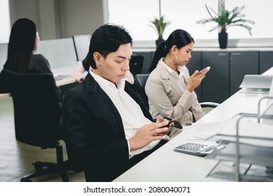 Office Employee Playing Smartphone At Work And Social Media Addicted Bad Habit For Business Company Problem.