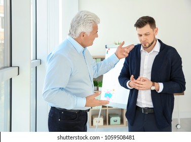 Office Employees Having Argument At Workplace