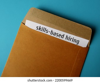 Office envelope and document written Skills-based Hiring - refers to practice of employers setting specific skill, emphasis potential employees rather than on degrees - Shutterstock ID 2200599669