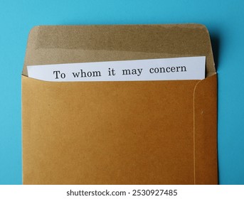 Office envelope with typed text document TO WHOM IT MAY CONCERN,formula placed at the beginning of letter or document when the identity of readers is unknown