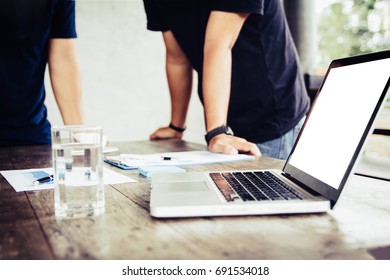 Office Equipment With Two Businessmen Talking At Break Time.