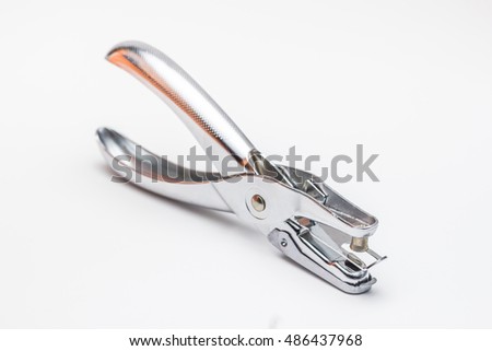 Office hole puncher on white background