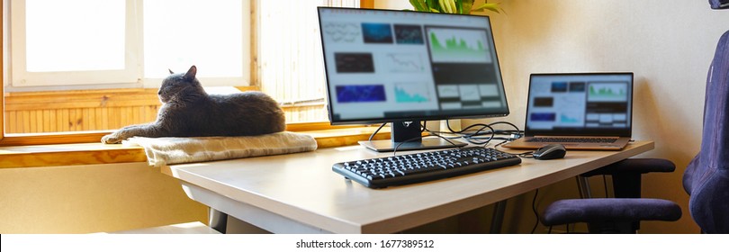 Office at home with IT equipment and online communications. Working from home and remote access concept. Panorama. - Shutterstock ID 1677389512