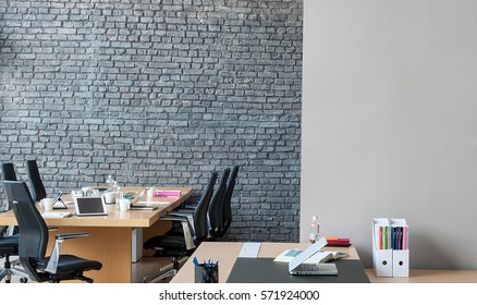 Office Interior Behind Brick Wall 