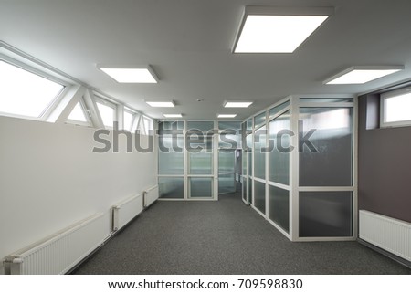 Office interior with glass walls.