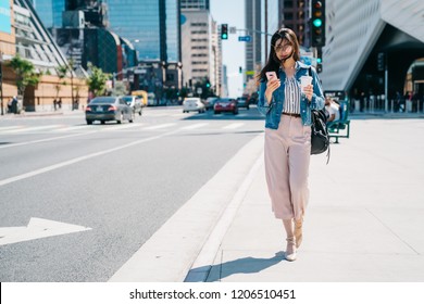 Office Lady Waiting Her Boyfriend To Pick Her Up Beside The Road After Work. Business Woman In Motion, Calling On Mobile Smart Phone Walking Outside In City Centre. Young Asian Worker Lifestyle.