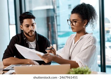 Office, laptop and colleagues with notebook, writing and together for collaboration of project online. Workplace, man and woman with teamwork, graphic designer and digital for photography and editor - Powered by Shutterstock