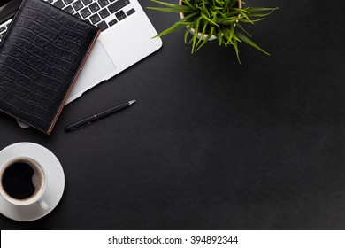 Office Leather Desk Workplace Table With Laptop, Coffee Cup, Notepad And Plant. Top View With Copy Space