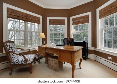 Office In Luxury Home Surrounded By Windows