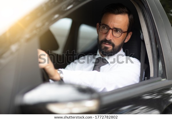 an office man going to the office by car and who is\
in traffic jams