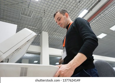 A office man operating a copy machine