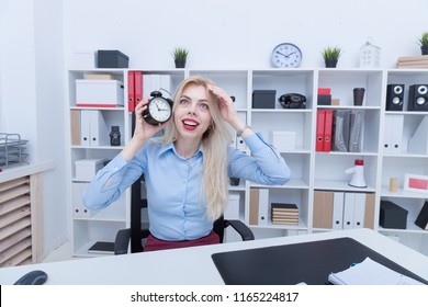 Office manager with alarm clock late to do the job - Shutterstock ID 1165224817