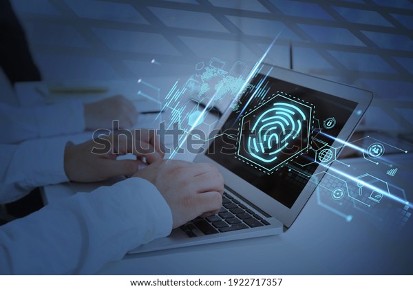 Office manager with electronic device on table, blue\
hud of hands and global network. Worldwide internet connection,\
candlesticks and map