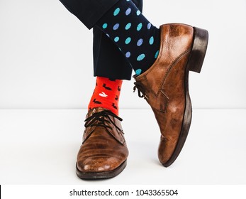 Office Manager in stylish shoes, blue pants and bright, colorful socks on a white background. Lifestyle, fashion, fun - Shutterstock ID 1043365504