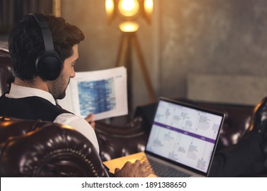 Office Manager Working On Computer At His Desk