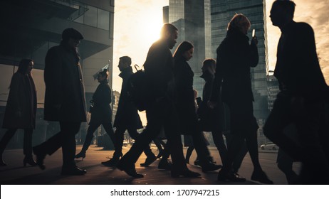 Office Managers and Business People Commute to Work in the Morning or from Office on a Sunny Day on Foot. Pedestrians are Dressed Smartly. Successful People Holding Smartphones. Sunny Day in Downtown