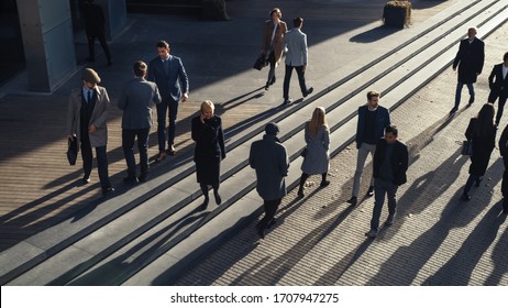 Office Managers and Business People Commute to Work in the Morning or from Office on a Sunny Day on Foot. Pedestrians are Dressed Smartly. Two Businessmen Shake Hands. Shot from Above.