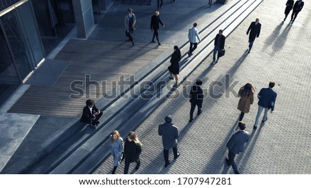 Office Managers and Business People Commute to Work in the Morning or from Office on a Sunny Day on Foot. Pedestrians are Dressed Smartly. Successful People Walking in Downtown. Shot from Above.