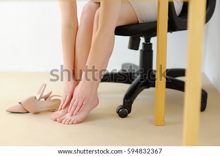 Office massage foot. Pain from high heels. Fatigue and relaxation.