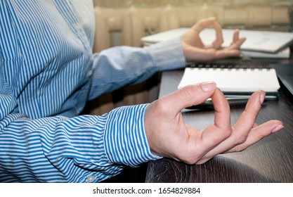 Office Meditation To Reduce Work Stress Relieving Concept, Female Hands In Mudra Close Look, Business Woman Practicing Yoga In The Workplace For Development Awareness. Mental Health And Balance. Close