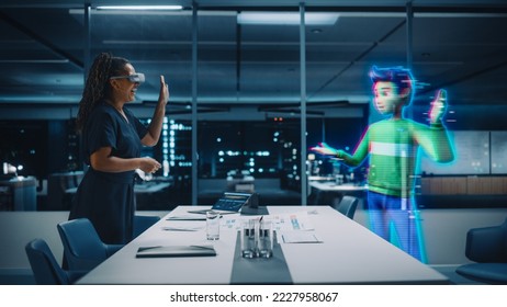 Office Online Meeting Video Conference Call: Businesswoman Wearing Virtual Reality Glasses to Talk With Digital Avatar of Colleague in Augmented Reality Metaverse. Hologram of Virtual Employee Concept - Shutterstock ID 2227958067