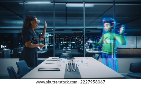 Office Online Meeting Video Conference Call: Businesswoman Wearing Virtual Reality Glasses to Talk With Digital Avatar of Colleague in Augmented Reality Metaverse. Hologram of Virtual Employee Concept