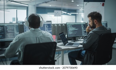 Office: Professional Black IT Programmer Uses Headphones while Working on Desktop Computer. Male Website Developer, Software Engineer Developing App, Video Game. Listening to Podcast, Music. - Shutterstock ID 2079730690