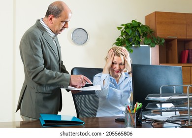 Office scene with angry chief and careless secretary  - Powered by Shutterstock