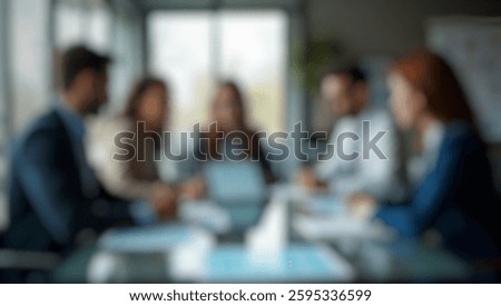 Office setting with a defocused abstract background of business people using a tablet. Perfect for collaboration, leadership, and teamwork themes.
