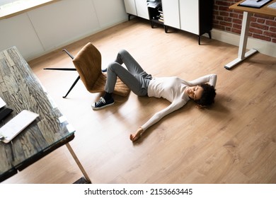 Office Slip And Fall Accident. Fainted Woman At Workplace - Shutterstock ID 2153663445