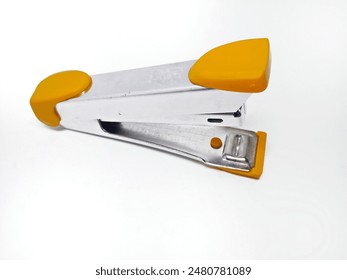 Office stapler close up in yellow on a white background - Powered by Shutterstock