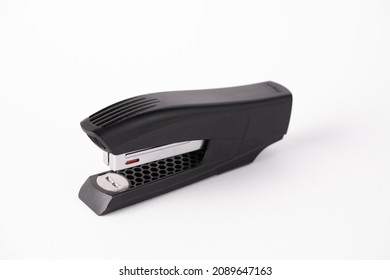 An office stapler isolated on a white background