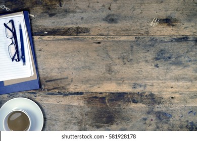 Office stuff and it gadgets display on top view business desk with copy space at text of picture. Creative table, modern project. Business empty vintage is background. Dark tone.Flat lay.