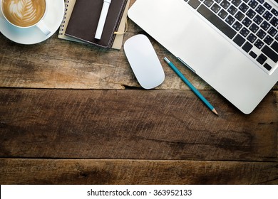 office stuff with notepad, laptop and coffee cup mouse notepad  top view shot. - Powered by Shutterstock