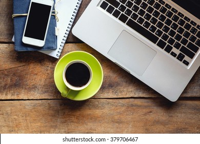 Office Stuff With Notepad, Laptop Smart Phone And Coffee Cup Mouse Top View Shot.
