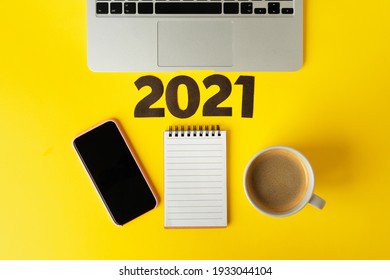 Office Supplies And 2021 Numbers. New Year Business Goals And Plans Concept