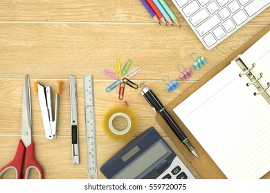 Office supplies and cup of coffee on wood table, top view - Powered by Shutterstock