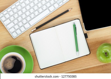 Office supplies, devices, coffee cup and apple on wooden table - Powered by Shutterstock