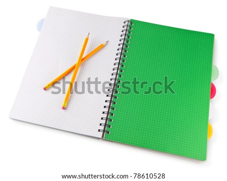 office supplies: opened notepad notebook with pensils over white background