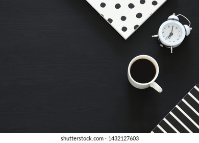 office supplies over black office desk table. Top view - Shutterstock ID 1432127603