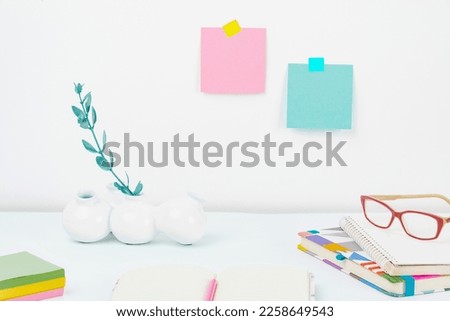 Office Supplies Over Desk With Keyboard And Glasses And Coffee Cup For Working Remotely, Assorted School Utilities For Studying With Hot Drink And Eyeglasses.