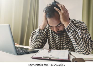 Office Syndrome Concept; Businessman Sitting At Office Desk,  Suffering From Backache After Working,man Touching Lower Back With Pained Expression.
