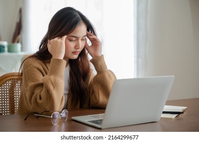 Office syndrome. Overworked tired young asian woman feeling headache, having eyesight problem after computer laptop work. Stressed young woman suffering from fatigue at home - Shutterstock ID 2164299677